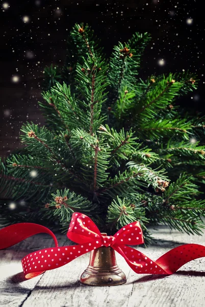 Nieuwjaar of Christmas bell met een rood lint in polka dots — Stockfoto