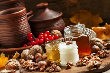 Three types of honey with walnuts and hazelnuts 
