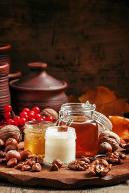 Three types of honey with walnuts and hazelnuts 