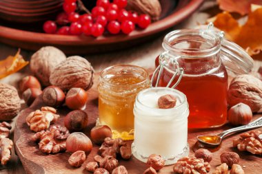 Three types of honey with walnuts and hazelnuts 
