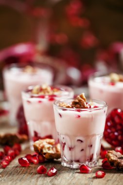Homemade yogurt with walnuts and pomegranate seeds 