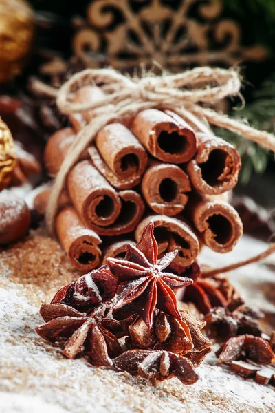 Christmas decoration with cinnamon, anice, pine cones and spruce branches — ストック写真