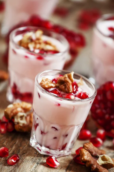 Homemade yogurt with walnuts and pomegranate seeds 