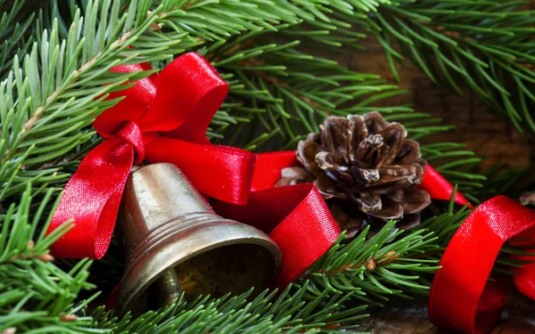 Christmas bell with a red ribbon — Stock Photo, Image