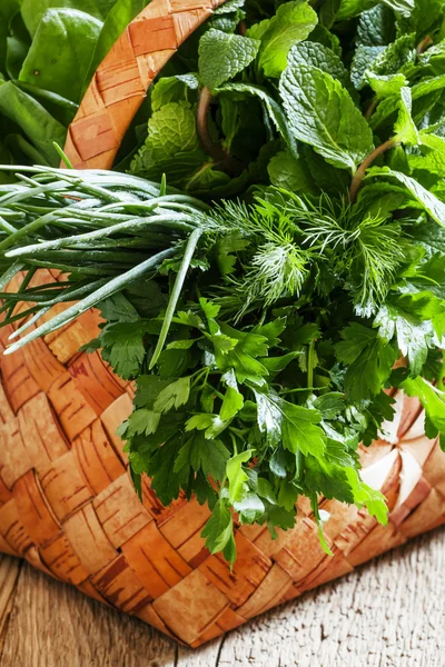 Herbs in a wicker basket — Stock Photo, Image