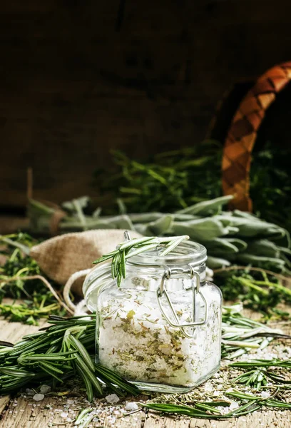 Sea salt with dried rosemary in a glass jar — Stock Photo, Image