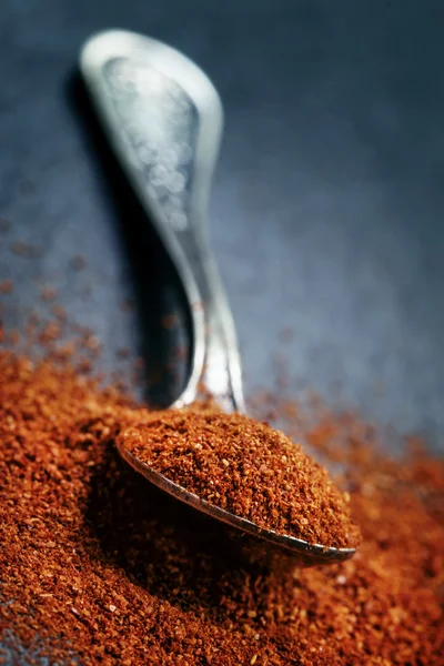 Ground chili pepper in a spoon — Stock Photo, Image