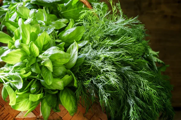 Spicy herbs in a wicker basket — Stock Photo, Image