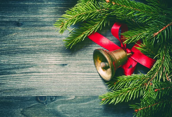 Christmas background with a bronze bell — Stock Photo, Image