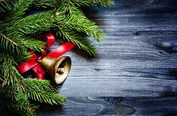 Christmas background with a bronze bell — Stock Photo, Image