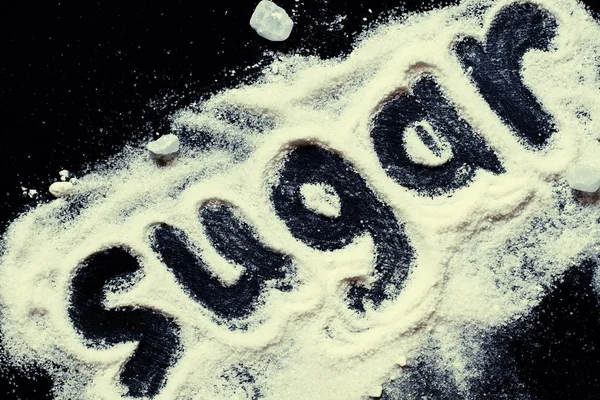 Słowo "cukru" białego cukru pudru i cukier puder — Zdjęcie stockowe