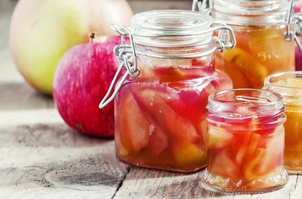 Autumn apple jam ripe red apples in jars