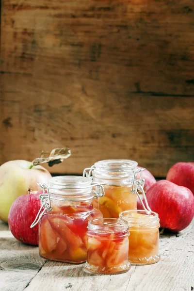Autumn apple jam ripe red apples in jars