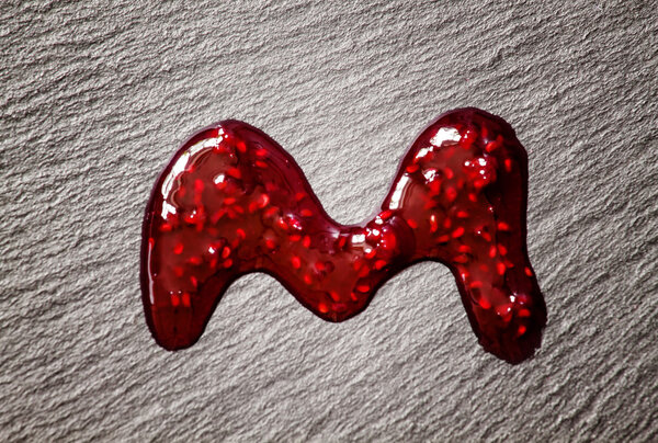Drops of red raspberry jam 