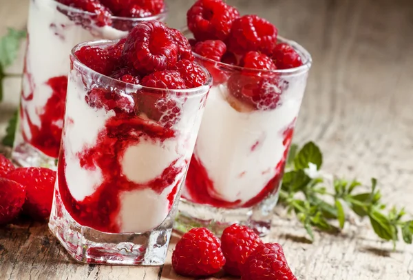 Raspberry ice cream with berries and mint