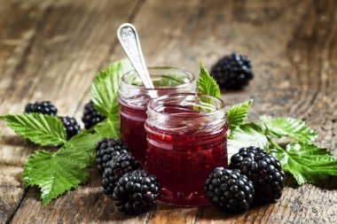 Two jars of blackberry jam clipart