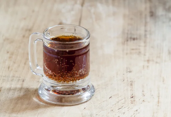 light beer in a little old-fashioned mug