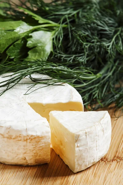 Camembert cheese with herbs — Stock Photo, Image