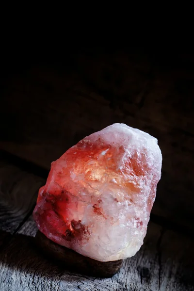 Burning salt lamp of Himalayan pink salt