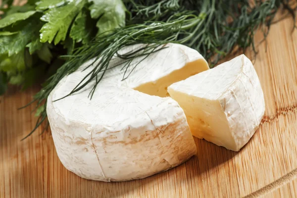 Camembert cheese with herbs — Stock Photo, Image