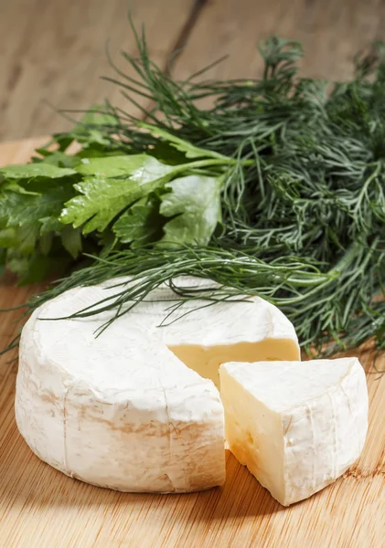 Camembert cheese with herbs — Stock Photo, Image