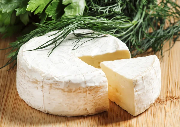 Camembert cheese with herbs — Stock Photo, Image