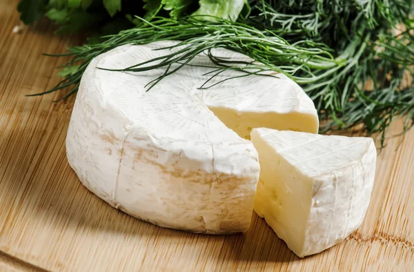 Camembert cheese with herbs — Stock Photo, Image