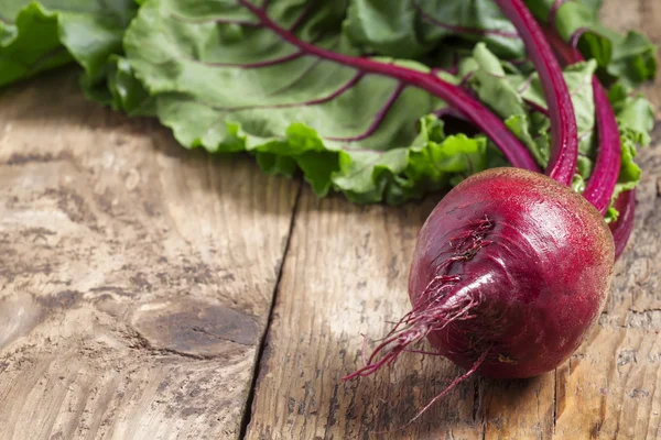 Fresh organic beetroot with tops — Stock Photo, Image