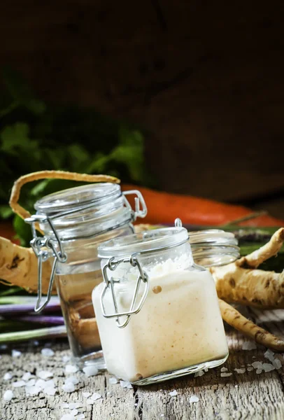 Grated horseradish in a glass jar — Stock Photo, Image