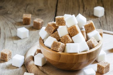 Cubes of white and brown sugar