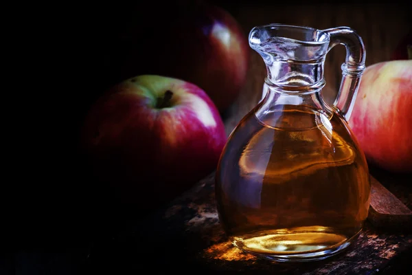 Homemade apple cider vinegar in a carafe — Stock Photo, Image