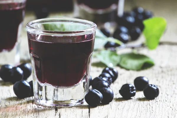 Homemade liqueur from aronia — Stock Photo, Image