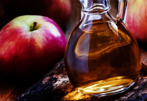 Homemade apple cider vinegar in a carafe — Stock Photo, Image