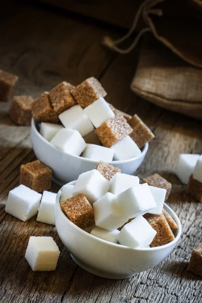 White and cane sugar in a porcelain bowls