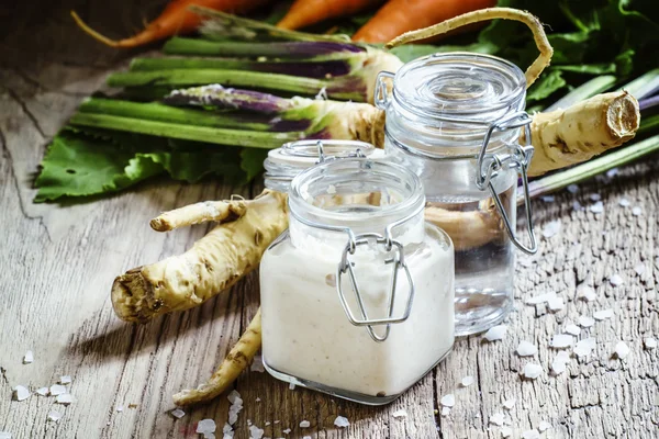 Grated horseradish, vintage wooden background — Stock Photo, Image