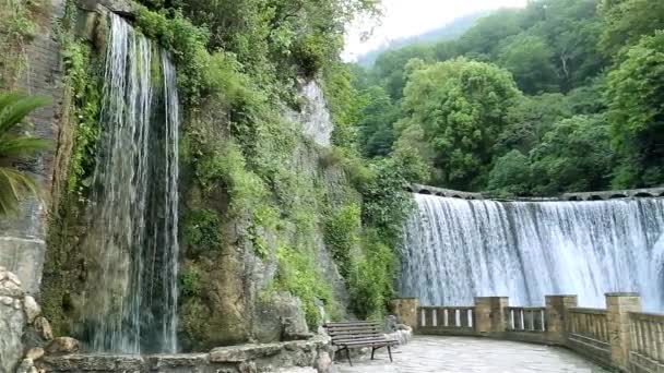 Abkhazia city of New Afon. Big beautiful waterfall, and near a small waterfall. Artificial waterfall near the hydroelectric power station. — Stock Video