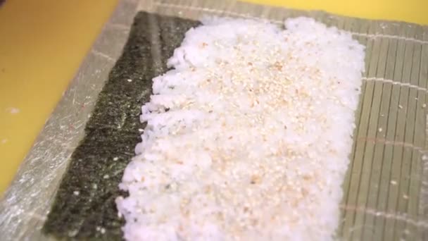 Man chef preparing rice sushi in the kitchen — Stock Video