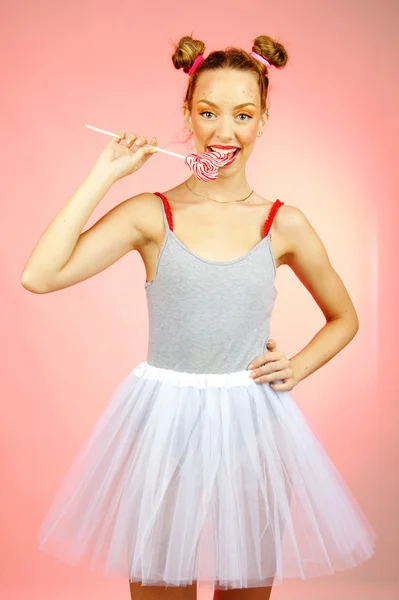 Sweet girl with candy with fracle on backgrpund — Stock Photo, Image