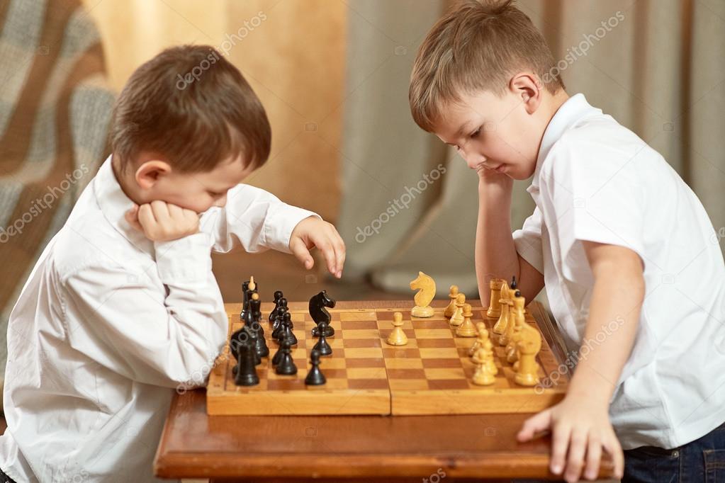 Two boys play board game hi-res stock photography and images - Alamy