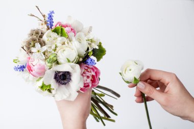 Prepering spring bouquet in hands