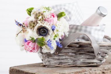 Rustic picnic basket with flowers
