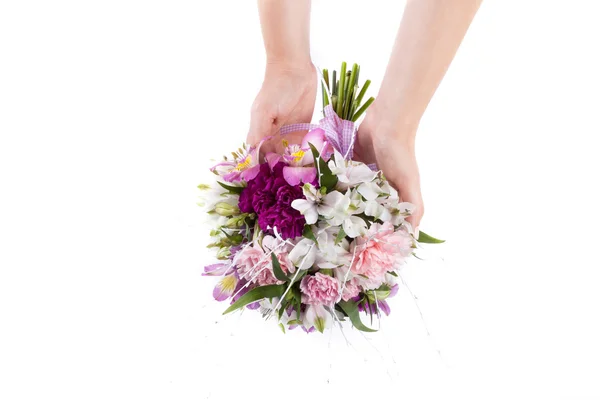 Hands holding a summer bouquet from pink and purple gillyflowers — Stock Photo, Image