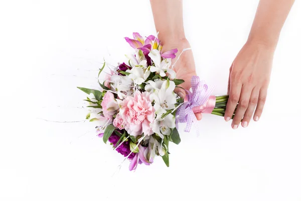 Hands holding a pink bouquet from gillyflowers and alstroemeria — Stock Photo, Image