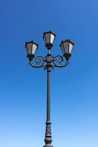 Street lamp against the blue sky. Street lighting and lighting fixtures