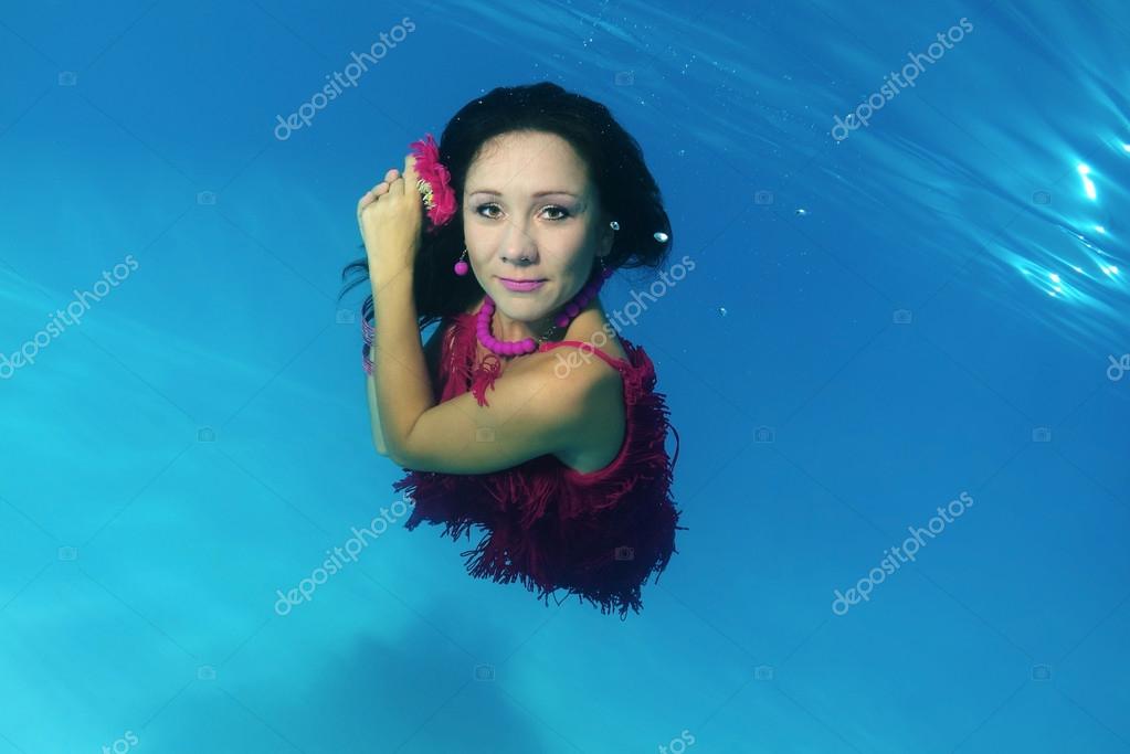 Woman presenting underwater fashion in pool \u2014 Stock Photo