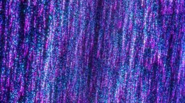 Parlayan neon parçacıkları ile soyut dijital arkaplan. Parlak noktalardan oluşan bir akıntının hareketi. Neon parçacıkları yağmuru. Kusursuz döngüsel soyut arkaplan.