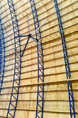 Vertical shot of dome ceiling featuring a hanging ceiling fan.