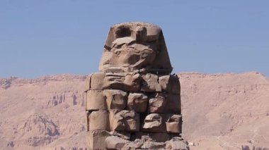 Luxor, Egypt  January 16, 2019: The Colossi of Memnon, two massive stone statues of Pharaoh Amenhotep III, stand as enduring symbols of ancient Egyptian engineering and cultural heritage.