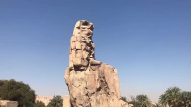 Luxor, Egypt  January 16, 2019: The Colossi of Memnon, two massive stone statues of Pharaoh Amenhotep III, stand as enduring symbols of ancient Egyptian engineering and cultural heritage.