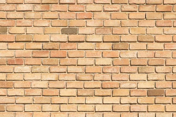 Old beige brick wall background texture — Stock Photo, Image